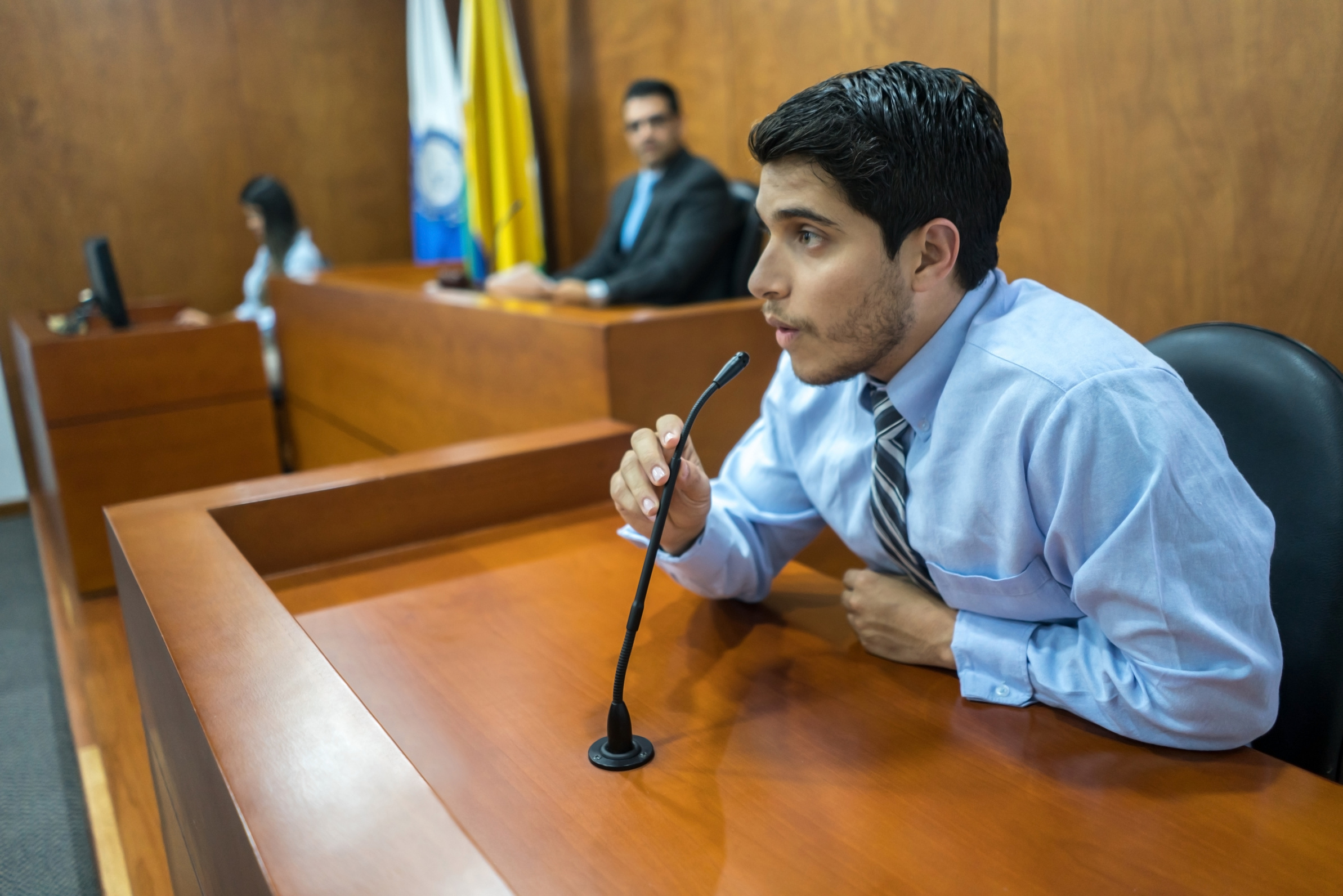 Witness addressing the courtroom in a trial